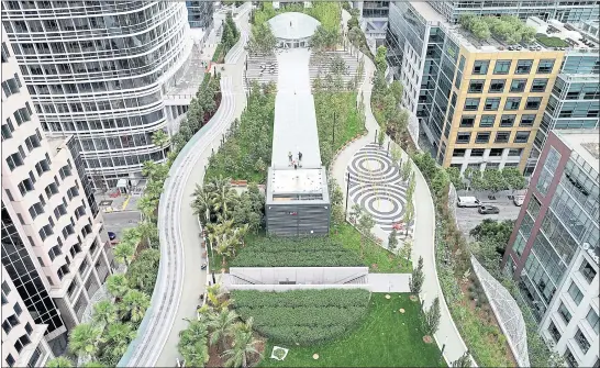  ?? JANE TYSKA — STAFF PHOTOGRAPH­ER ?? The Transbay Transit Center and rooftop park in downtown San Francisco is seen from a drone Wednesday. A grand opening block party is set for Saturday.