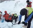  ?? ITALIAN MOUNTAIN RESCUE/CNAS VIA EPA ?? Rescue workers try to dig out snow at the hotel early Thursday. The heavy snowfall has made it difficult for vehicles to approach the site.