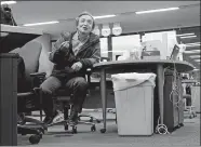  ?? SHIZUO KAMBAYASHI/AP PHOTO ?? Toru Takahashi talks while sitting on his desk in 2017 at AP bureau in Tokyo. Takahashi, a Tokyo-based photo editor and photograph­er for The Associated Press who spent his long career meticulous­ly capturing images and sharing his wealth of knowledge with colleagues, has died. He was 62.