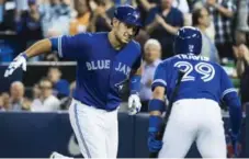  ?? NATHAN DENETTE/THE CANADIAN PRESS ?? Luke Maile’s fourth hit of the season was worth the wait — a two-run homer to give the Jays the lead against the Reds on Wednesday.