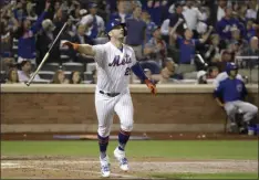  ?? KATHY WILLENS - THE ASSOCIATED PRESS ?? New York Mets’ Pete Alonso (20) tosses his bat as he trots down the first base line after hitting a solo home run during the fourth inning of a baseball game against the Chicago Cubs, Tuesday, Aug. 27, 2019, in New York. With the home run, Alonso set the Mets’ single-season home run record.