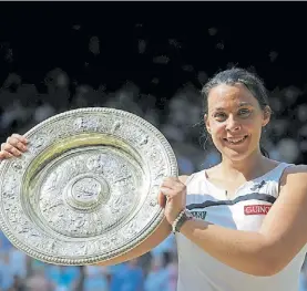  ?? AP ?? Antes. Marion Bartoli ganó su único Grand Slam en el césped inglés.