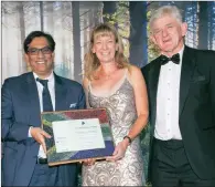  ??  ?? The Investec Equity Fund scooped the special Raging Bull for outright performanc­e by a South African equity general fund over 21 years. Gail Daniel, a portfolio manager at Investec Asset Management, collected the award from Dr Iqbal Survé, the...