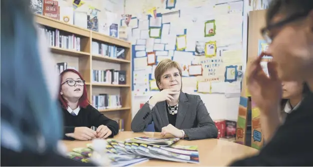  ??  ?? 0 Sturgeon visits Renfrew High School to announce registrati­on for the First Minister’s Reading Challenge is now open to both primary and secondary schools