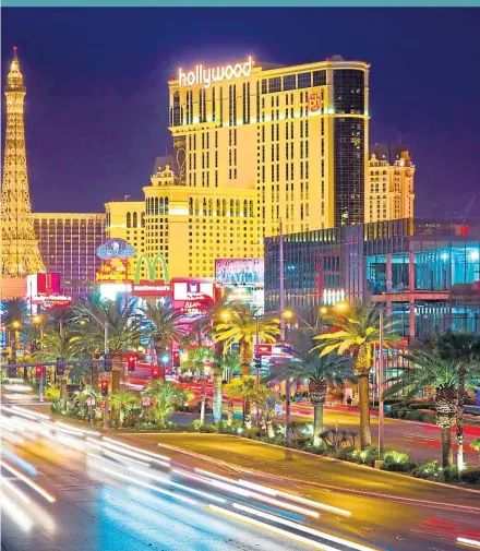  ??  ?? ● Bright lights, big city: The Strip is a neon wonderland, in contrast to the desert surroundin­g the city, far left, which really has to be seen by helicopter, particular­ly the Grand Canyon