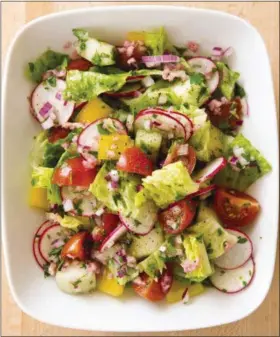  ?? JOE KELLER/AMERICA’S TEST KITCHEN VIA THE ASSOCIATED PRESS ?? This undated photo provided by America’s Test Kitchen shows a summer vegetable chopped salad in Brookline, Mass.