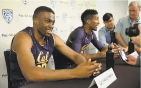  ?? Eric Risberg / Associated Press ?? New Cal head coach Wyking Jones looks forward to having 7-foot-1 Kingsley Okoroh (left) and 6-11 Marcus Lee (center) on the court at the same time.