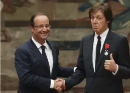  ?? (Reuters) ?? FRENCH PRESIDENT Francios Hollande and Paul McCartney at the Elysee Palace in Paris last year after the former Beatle received the Legion d’Honneur.