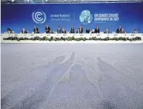  ?? ?? Sumit Chancellor Rishi Sunak and Mark Carney, British Prime Minister Boris Johnson’s Finance Adviser for COP26, pose for a picture with world finance ministers at COP26