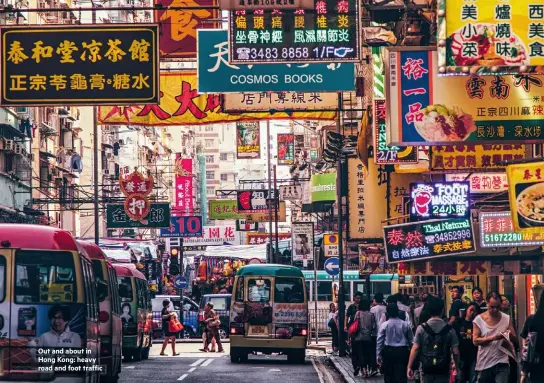  ??  ?? Out and about in Hong Kong: heavy road and foot traffic