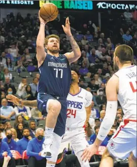  ?? LM Otero Associated Press ?? LUKA DONCIC of Dallas, who scored a career-high 51 points against the Clippers on Thursday, has had seven of his 10 highest-scoring games against them.