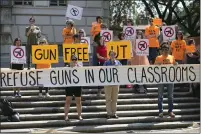  ?? RALPH BARRERA — AUSTIN AMERICAN-STATESMAN VIA AP, FILE ?? Protesters gather on the West Mall of the University of Texas campus in Austin, Texas, to oppose a new state law that expands the rights of concealed handgun license holders to carry their weapons on public college campuses on Oct. 1, 2015. The NCAA has a rule forbidding guns on the premises of its championsh­ip events, presumably meaning Houston’s NRG Stadium will be gun free for the Final Four next month.