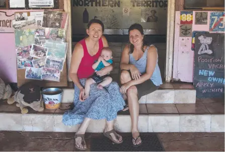  ??  ?? Lost in Larrimah creators Kylie Stevenson (with her baby Eddie) and Caroline Graham outside the Larrimah Hotel.