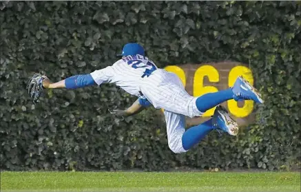  ?? Wally Skalij Los Angeles Times ?? CUBS CENTER FIELDER Dexter Fowler makes a diving catch of a ball hit by Carlos Ruiz in the fourth inning. The Dodgers hit a lot of balls hard in Game 1, but the Cubs were either in the right spots or making plays such as this one.