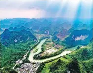  ?? LI BIN / FOR CHINA DAILY ?? Guangxi boasts picturesqu­e rivers and mountains.