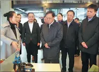  ??  ?? Chen Wenhao, deputy Party secretary and mayor of Changsha, inspects an innovation and culture area in the city.