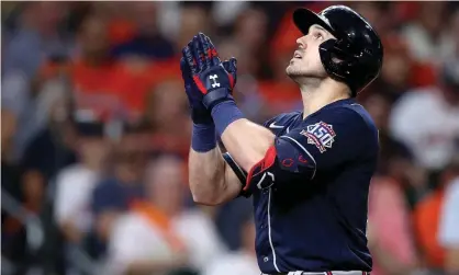  ?? Photograph: Elsa/Getty Images ?? Adam Duvall of the Atlanta Braves celebrates after hitting a two run home run against the Houston Astros in Game 1 of the World Series.