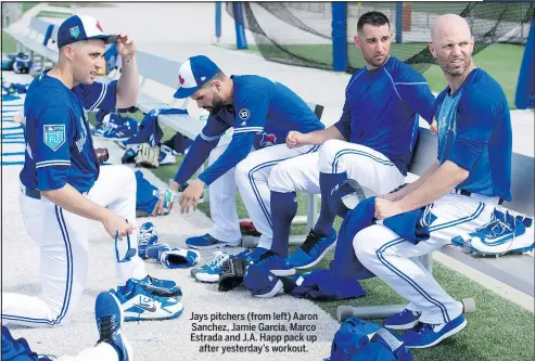  ?? FRANK GUNN/CANADIAN PRESS ?? Jays pitchers (from left) Aaron Sanchez, Jamie Garcia, Marco Estrada and J.A. Happ pack up after yesterday’s workout.