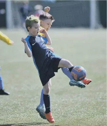  ??  ?? Russell Foster U7s action between Washington AFC Wildcats (navy) and Velocity Pumas, played at Temple Park Centre, South Shields.