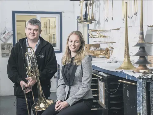  ??  ?? CHINA SALES DRIVE: Rath Trombones’ founder, Mick Rath, with Chamber Internatio­nal executive, Lydia Sykes, at the company’s workshop in Honley, West Yorkshire.