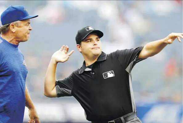  ?? NOAH K. MURRAY/THE ASSOCIATED PRESS ?? First base umpire Jansen Visconti tosses Blue Jays manager John Gibbons out of the game during the sixth inning of Toronto’s 10-2 loss to the Yankees on Sunday in New York. The Jays were swept as they surrendere­d 28 runs in the three-game series.