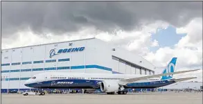  ?? AP/MIC SMITH ?? A Boeing 787-10 Dreamliner is towed back to the company’s plant in South Carolina after its first test flight Friday. Boeing’s new deal with Iran Aseman Airlines adds to the one the plane-maker already has with Iran Air.