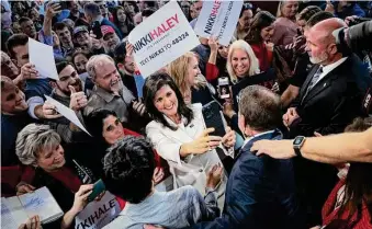  ?? Win McNamee/TNS ?? Republican presidenti­al candidate Nikki Haley greets supporters last week following her first campaign event in Charleston, S.C. She is the first to challenge Donald Trump for the GOP nod.