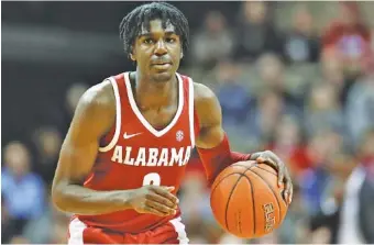  ?? AP PHOTO/MARK HUMPHREY ?? Alabama freshman guard Kira Lewis Jr. had his fifth consecutiv­e double-digit scoring game in last Saturday’s loss to Florida, but he was held to five points Tuesday night in an embarrassi­ng setback at Texas A&amp;M.