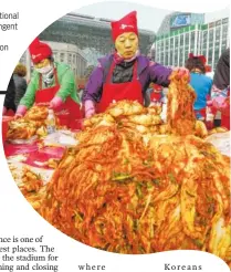  ??  ?? Women make kimchi, a traditiona­l fermented South Korean pungent vegetable dish, to donate to needy neighbors in preparatio­n for the winter season during Kimchi Festival at Seoul City Hall Plaza.