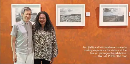  ?? LOW lay PHON/THE Star ?? Foo (left) and Nirmala have curated a riveting experience for visitors at the fine art photograph­y exhibition.