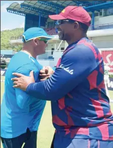  ??  ?? West Indies head coach Phil Simmons, right, is upset with his team’s batting displays.