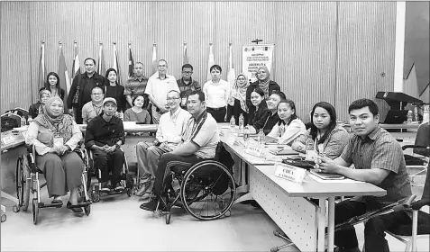  ??  ?? The writer with participan­ts of the AUN-DPPnet Accessibil­ity and Universal Design Training Programme.