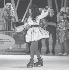  ?? MICHAEL CLEVENGER/COURIER JOURNAL ?? Dusty Ray Bottoms, with RuPaul’s Drag Race, performs during the opening number for the 4th annual Drag Queens on Ice at Paristown’s Fête de Noël Crystal Ice-Skating Rink on Dec. 3.