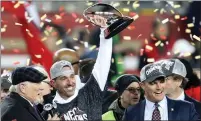  ?? RAY CHAVEZ — BAY AREA NEWS GROUP ?? Terry Bradshaw, left, interviews 49ers head coach Kyle Shanahan as general manager John Lynch looks on as they celebrate with their NFC Championsh­ip trophy after defeating the Packers at Levi’s Stadium in Santa Clara on Sunday.