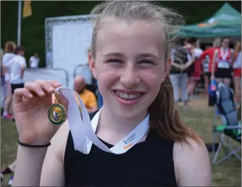  ??  ?? Ruby Reynolds (Menapians), winner of the Under-13 60m hurdles.