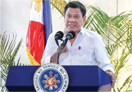  ??  ?? Philippine President Rodrigo Duterte gestures during a press conference shortly after arriving from Singapore at Davao internatio­nal airport in southern island of Mindanao early Saturday. (AFP)