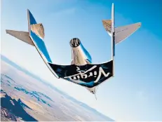  ??  ?? Rocket power: Virgin Spaceship Unity, a manned spaceplane, flew to space in 2018