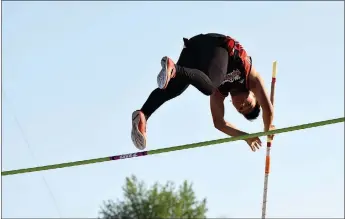  ?? RICK PECK/SPECIAL TO MCDONALD COUNTY PRESS ?? McDonald County’s Huechi Xiong clears 12-6 in the pole vault at the Big 8 Conference Track and Field Championsh­ips to tie with teammate Zack Woods for second place. The meet was held May 7 at MCHS.