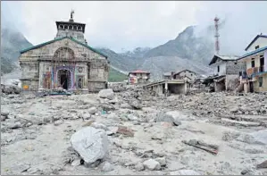  ?? HT PHOTO ?? The Kedarnath shrine on June 22, 2013, in the aftermath of the flood that devastated Rudrapraya­g