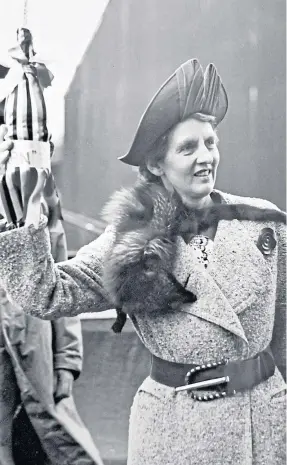  ?? ?? Clockwise from above; Mrs C E Wurtzburg, wife of the Glen Line managing director, prepares to launch the Glenearn at Dundee in 1938; the ship on the slipway; and the Glenearn model at Chatham dockyard in Kent.