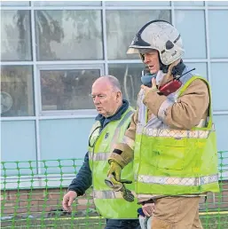  ?? Pictures: Steve Brown. ?? The fire service and Police Scotland in attendance at the heavily-damaged building at St Andrews University yesterday.