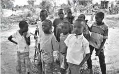  ?? Associated Press ?? ■ South Sudanese refugee children gather near a water point March 12 in the Rhino refugee settlement near Arua in northern Uganda. The flood of South Sudanese refugees from the country's 5-year civil war has been called a children's crisis, with more...