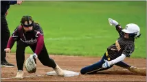  ?? ALEXANDER MULLER — FOR MEDIANEWS GROUP ?? Clawson’s Ava MacNeill (right) slides into third base as Warren Mott third baseman Addison Brown catches the throw and works to apply the tag in a MAC Gold game on Friday. Clawson won, 11-1 in five innings.