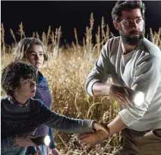  ?? PARaMOUNT PICTURES ?? John Krasinski, seen with co-stars Noah Jupe, left, and Millicent Simmonds, could be busy this awards season.