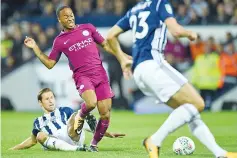  ??  ?? Manchester City’s English midfielder Raheem Sterling (2nd L) vies with West Bromwich Albion’s Polish midfielder Grzegorz Krychowiak (L) during the English League Cup third round football match between West Bromwich Albion and Manchester City at The...