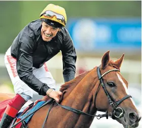  ??  ?? Power and glory: Frankie Dettori and Stradivari­us win yesterday’s Goodwood Cup