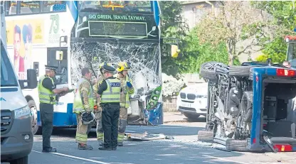  ?? Picture: Kim Cessford. ?? Crews at the scene of the crash on Strathern Road at the junction with Fairfield Road.