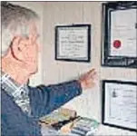  ??  ?? Proud moments: Hanging on the wall in Tony FitzHerber­t’s den are some of his proudest achievemen­ts.