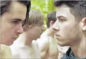  ?? Ethan Palmer ?? FRATERNITY hazing tests the loyalty of brothers played by Ben Schnetzer, left, Nick Jonas in “Goat.”