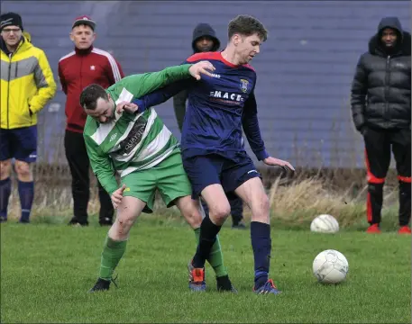  ??  ?? Justin Curran of Glenview Stars in action with MCR’s KeIth Gilmartin. Pic: Carl Brennan.